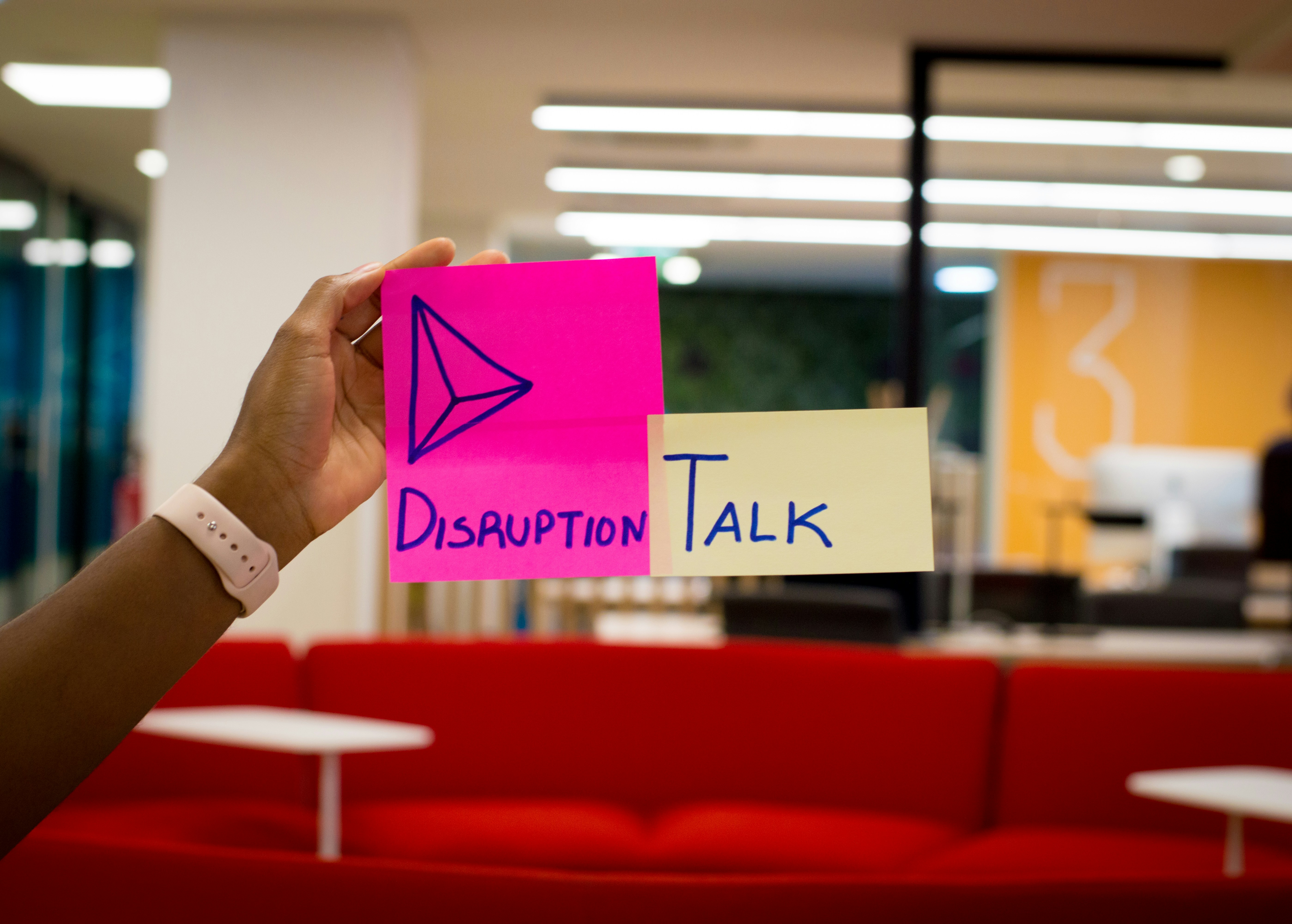 Sticky note with the words "disruption talk"
