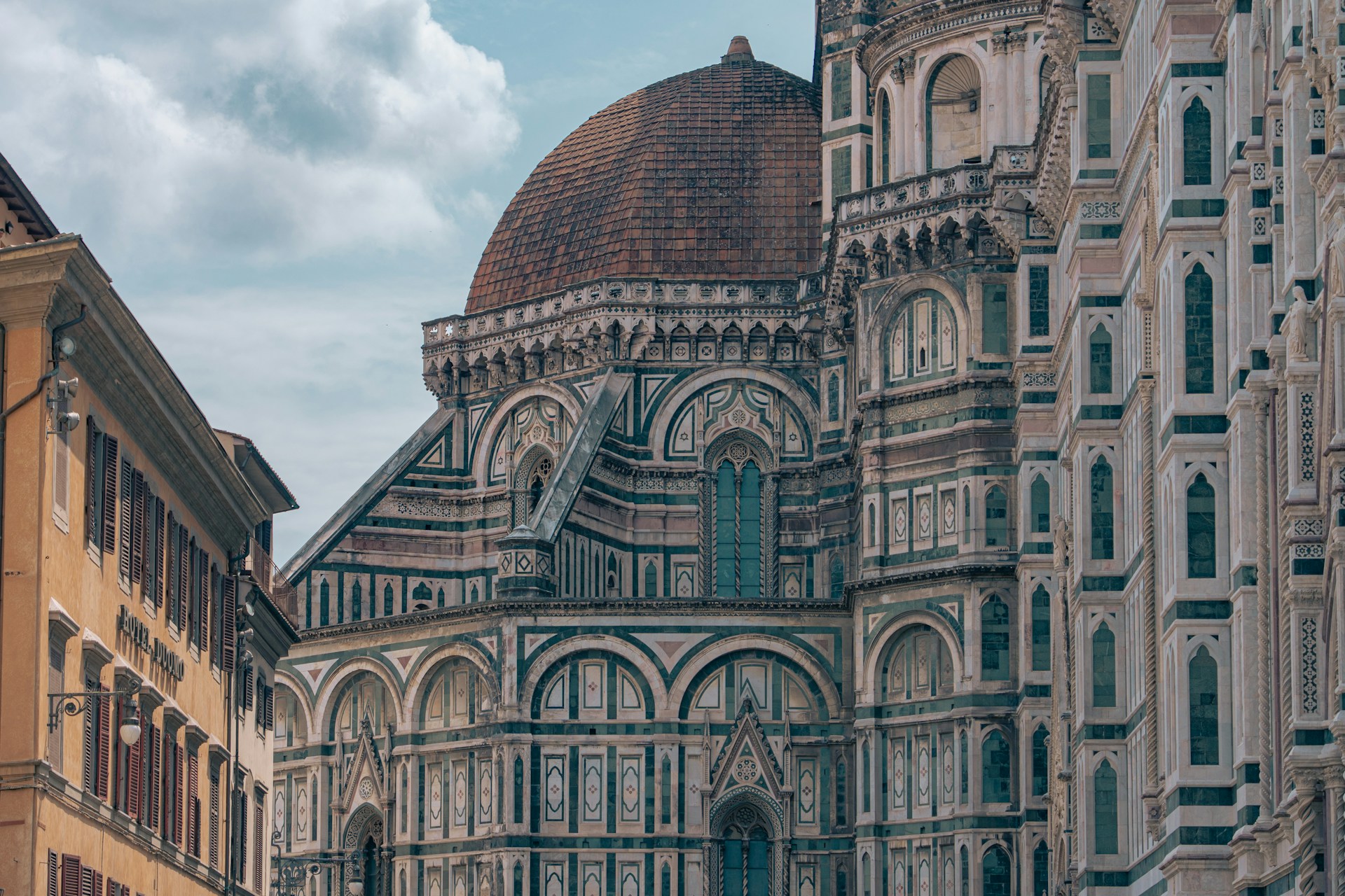 -tall-building-with-a-clock-on-the-front-of-it