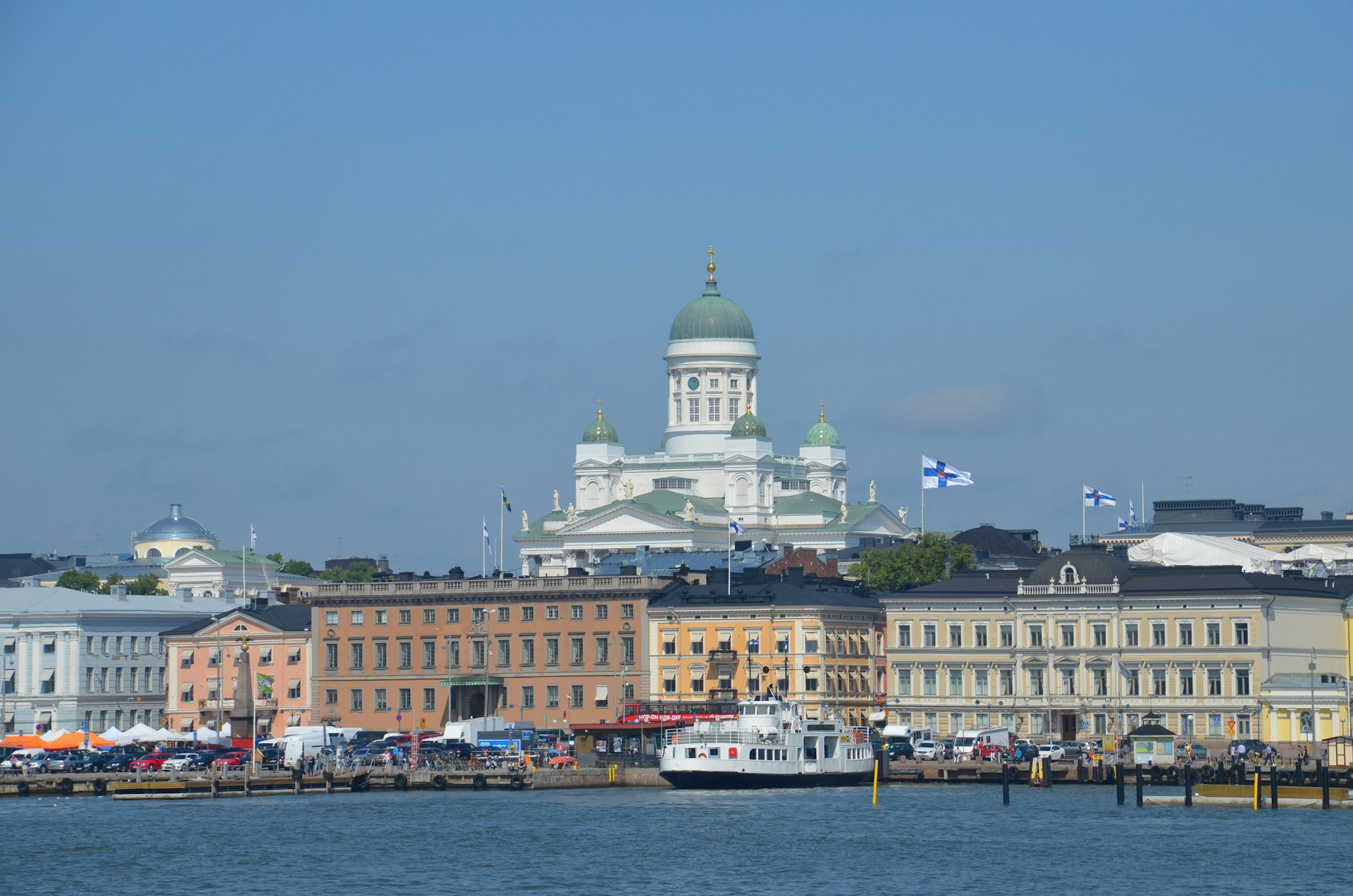 white-and-brown-concrete-building-near-body-of-water-during-daytime
