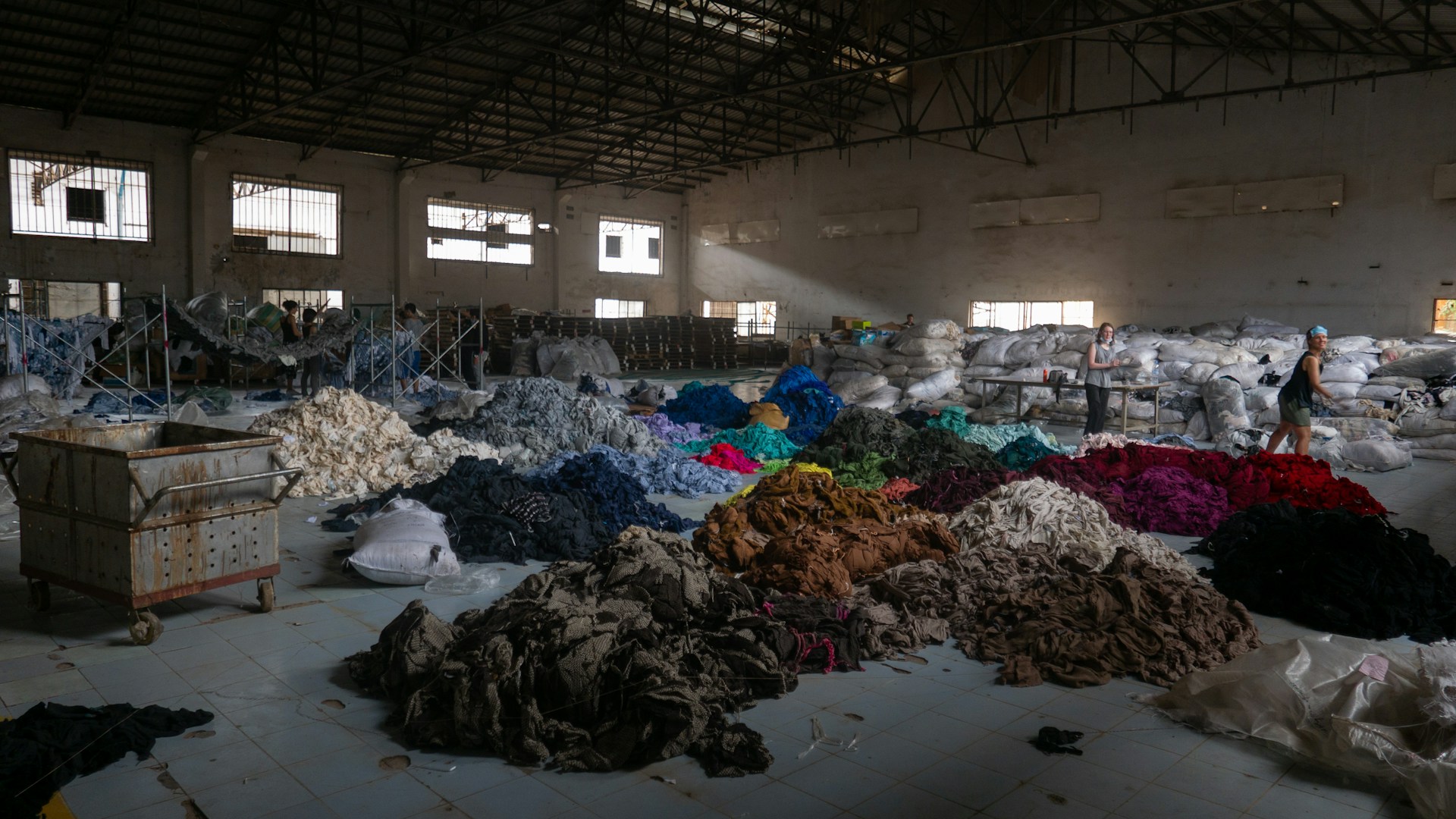 Photograph of textile waste divided by colour 