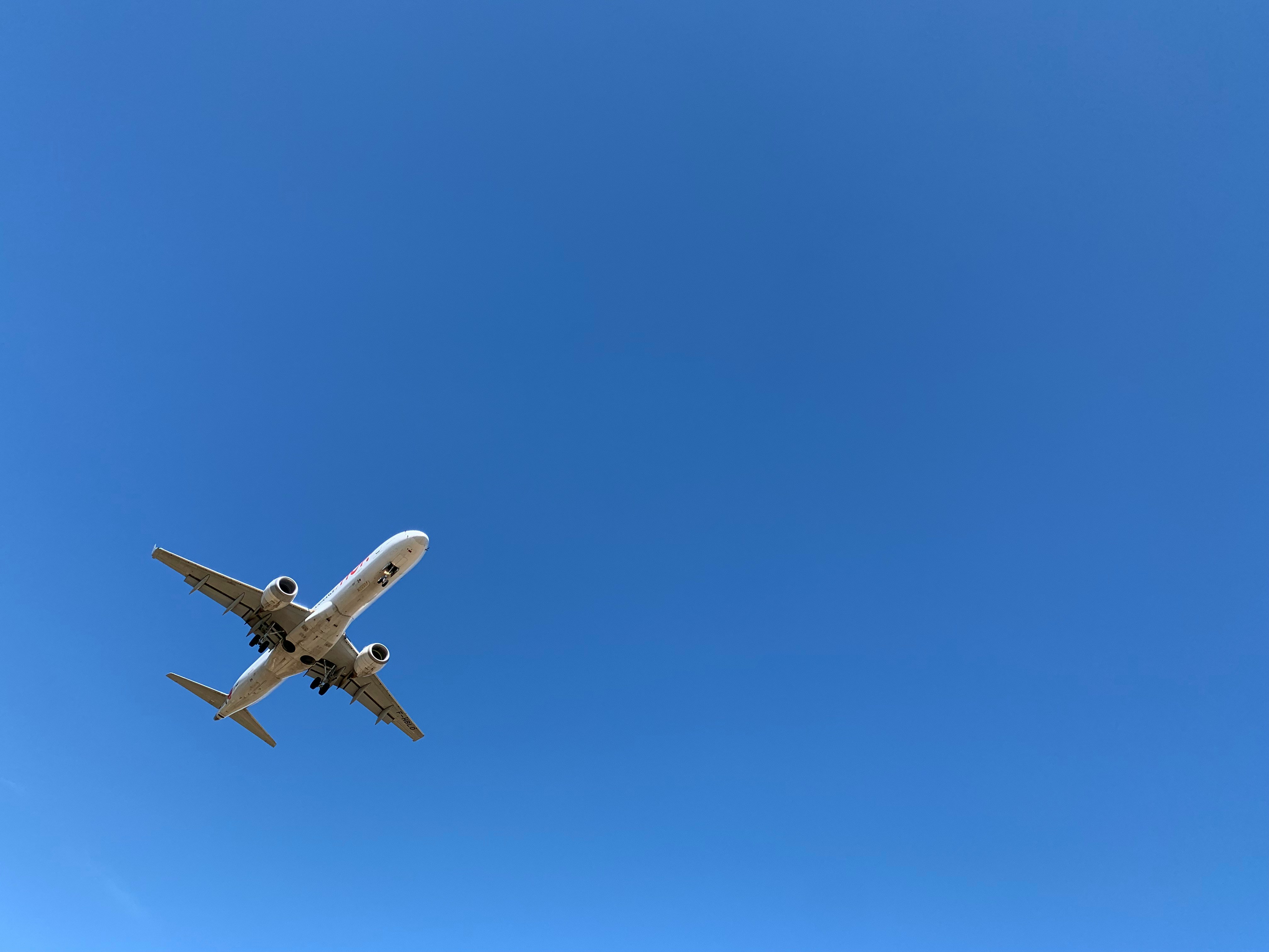 a-large-jetliner-flying-through-a-blue-sky