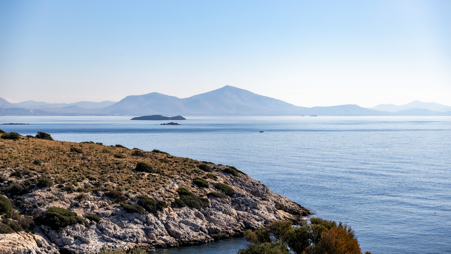 a-view-of-a-body-of-water-with-mountains-in-the-background