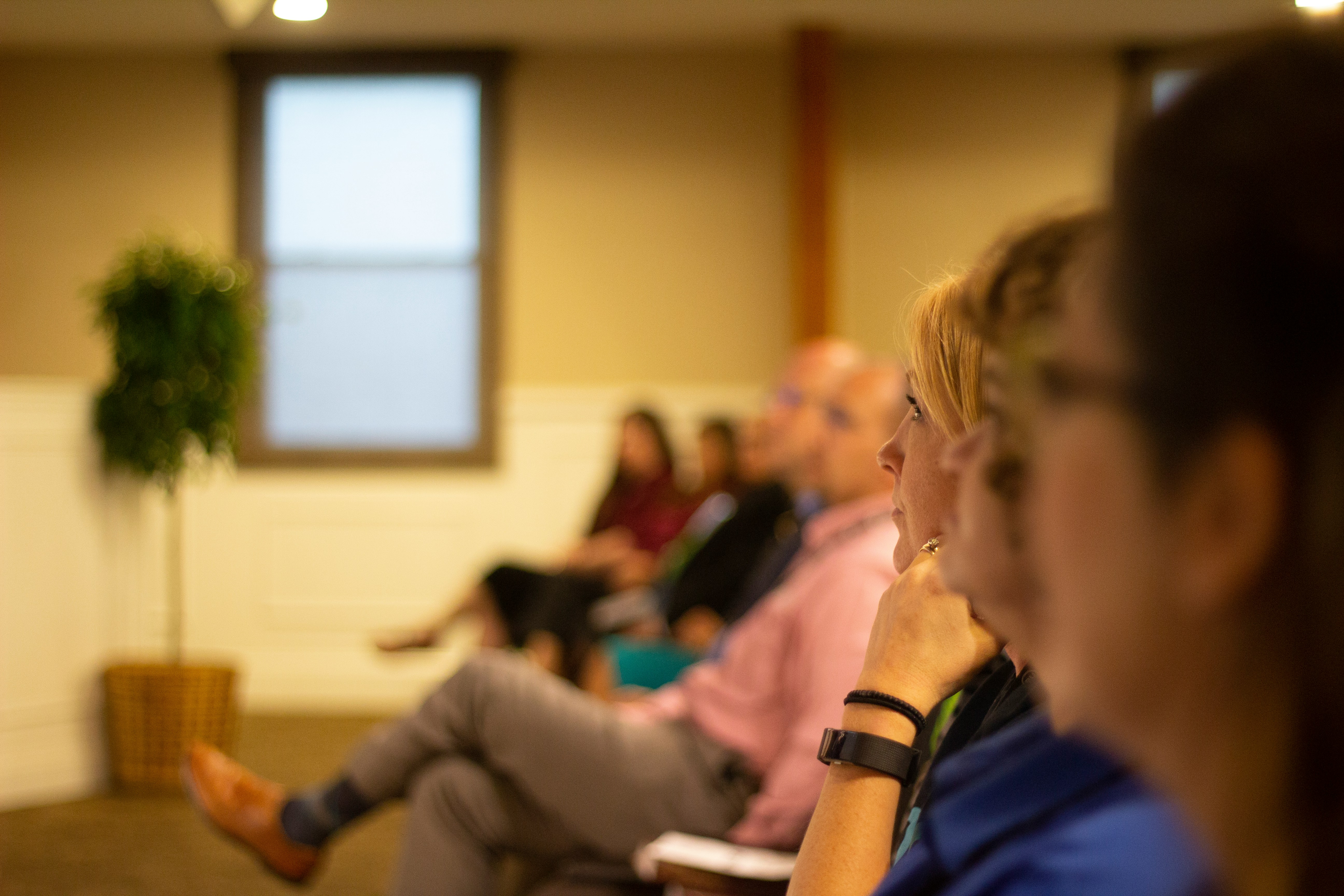 A group of people sitting in a room.