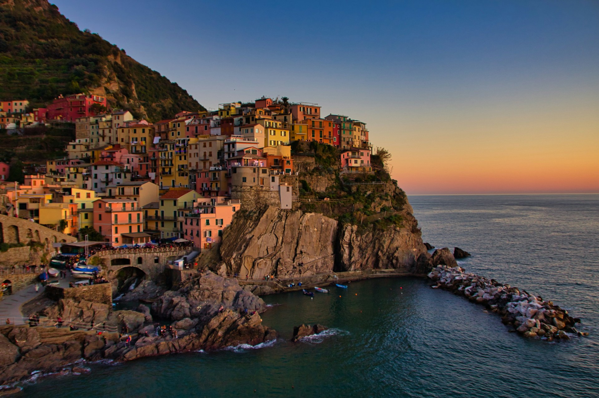 city-buildings-on-cliff-beside-sea-during-daytime