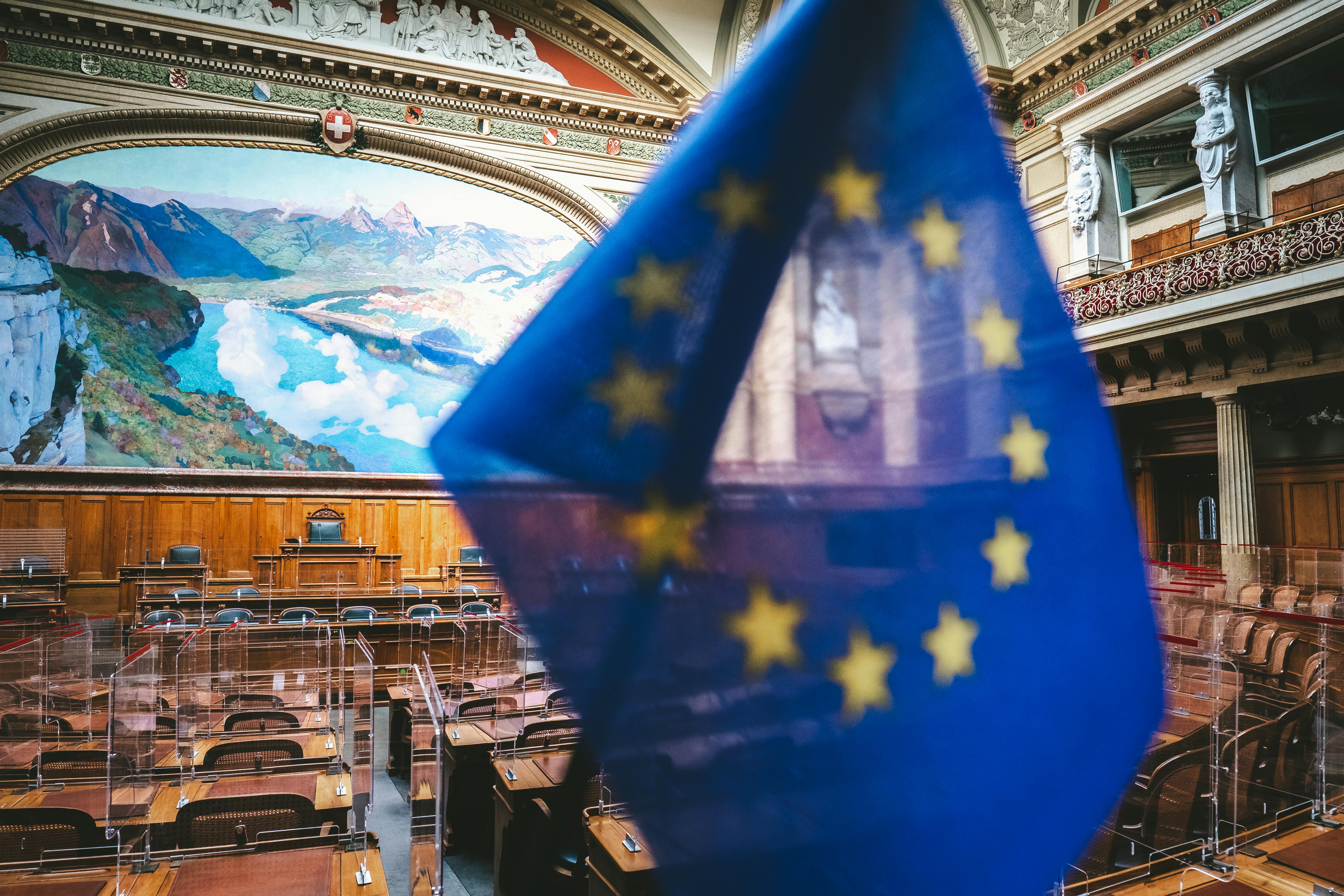 European flag in front of Swiss Parliament Chamber.