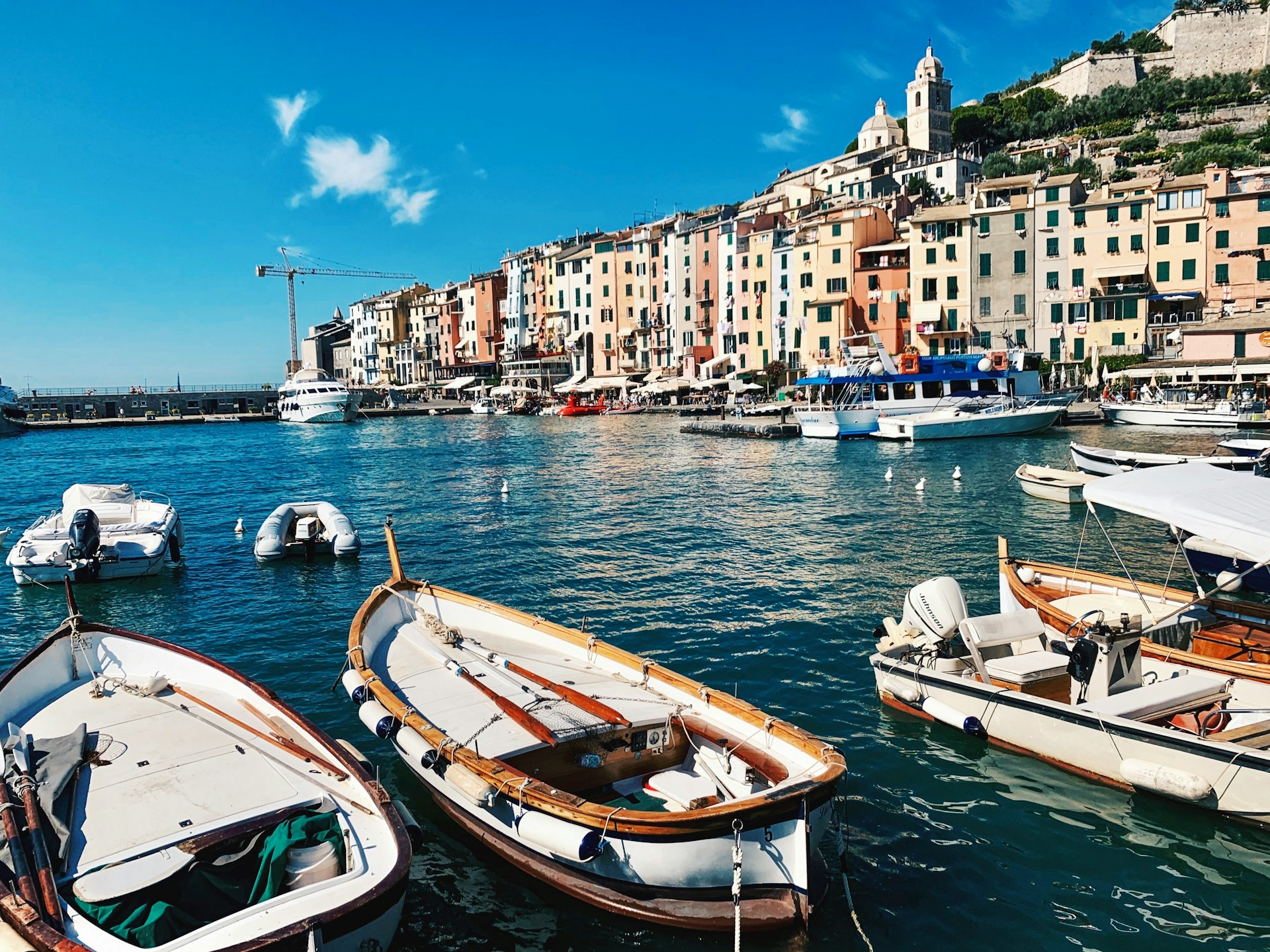 white-motor-boat-parked-on-sea-