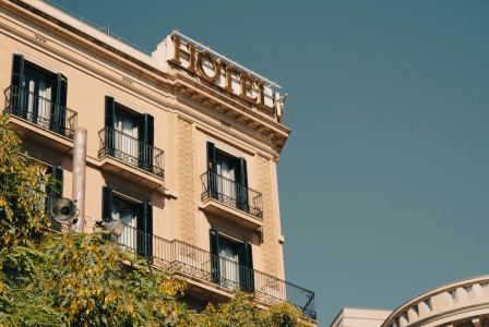 a-hotel-sign-on-top-of-a-building
