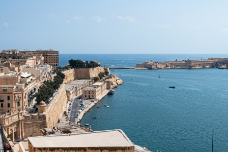 a-large-body-of-water-next-to-a-city