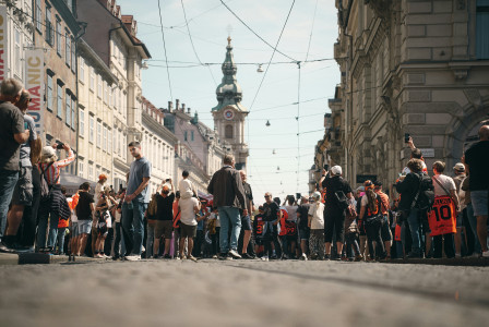 crowd-of-people-walking-down-a-european-street-