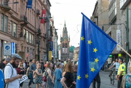 people-walking-on-road-between-buildings
