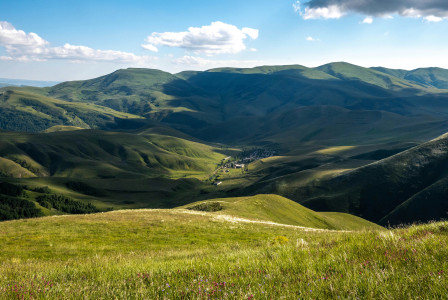 a-valley-with-mountains-in-the-background