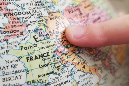 person-holding-white-and-blue-map