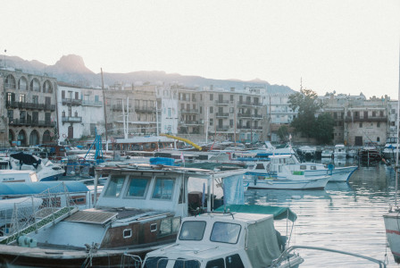 a-harbor-filled-with-lots-of-boats-next-to-tall-buildings