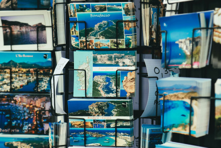selective-focus-photography-of-landmarks-card-on-rack-