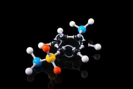 A molecule model with reflection on a dark surrounding.