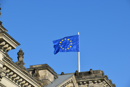 Waving blue and yellow EU flag.