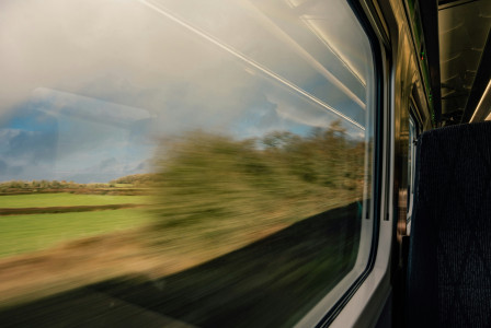 a-blurry-photo-of-a-train-going-by