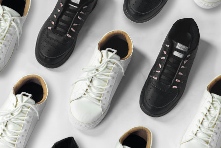 White and black sneakers displayed against a white background.