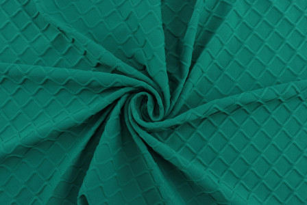 emerald green stretch fabric close up
