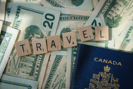 A photo of a passport and cash symbolizing travel expenses.