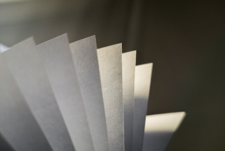 White paper on gray surface.