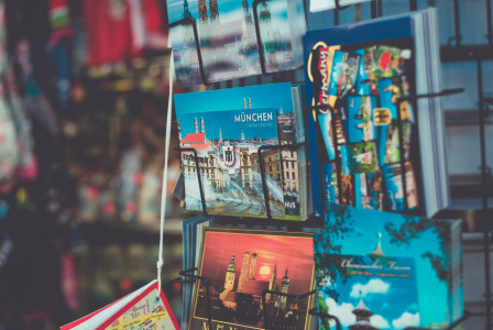 A picture presents postcards displayed on a souvenir stand.