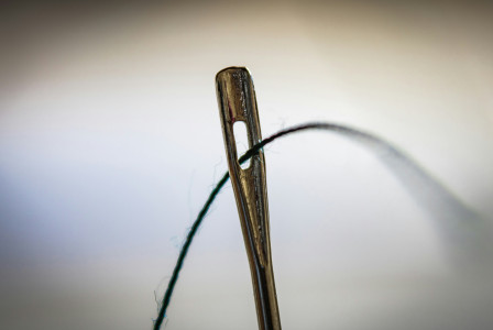 close up of needle and thread