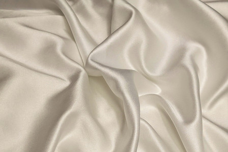 close up of beige silk fabric 