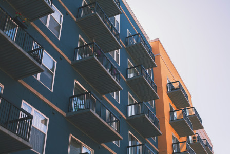 The picture shows residential buildings linked to housing affordability and urban development.