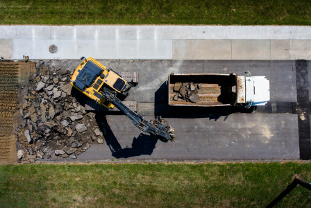 This picture describes road demolition and material recovery activities.