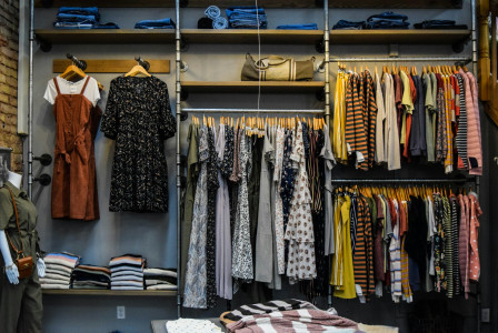 The photo presents clothes displayed in a retail store.
