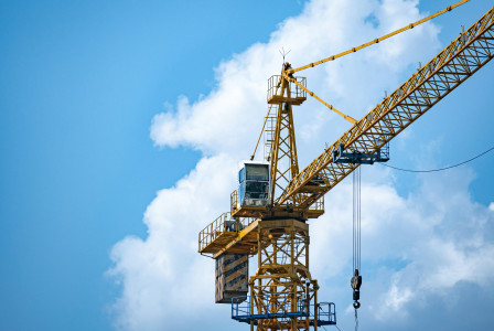 The picture shows infrastructure and equipment used in the construction of large residential developments.