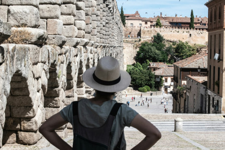 The photo presents a tourist visiting a historic city.