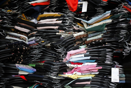 A pile of clothes that are sitting on a table.