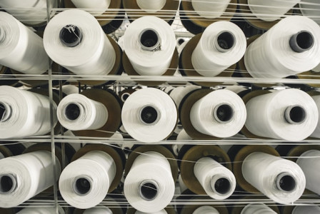 A rack of rolls of white paper in a store.
