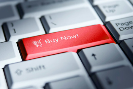 The photo presents a “Buy Now” button on a keyboard.