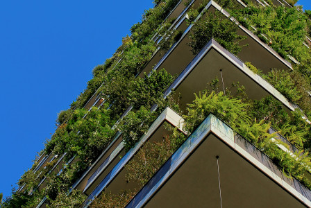 The picture shows a building incorporating green infrastructure to support environmental performance and sustainability.