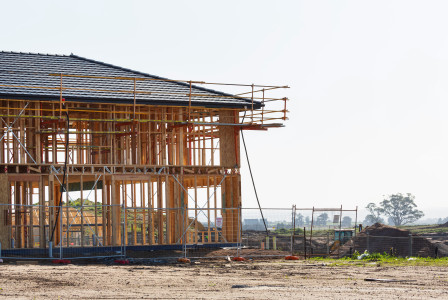 The picture shows construction activity on a building site.  