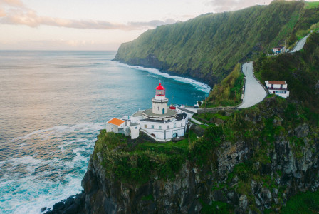 The photo presents a lighthouse near Ribeira Grande in the Azores, Portugal.