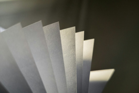 White paper on gray surface.