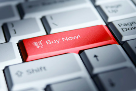 The photo presents a red keyboard key labelled “Buy Now!” with a shopping cart icon, surrounded by grey keys.