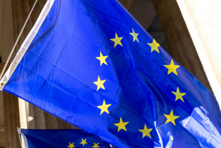 A blue and yellow flag with yellow stars on it.