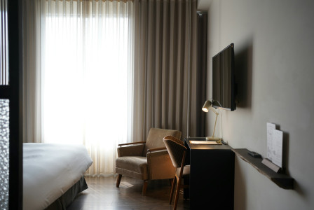 The photo presents a modern hotel room.