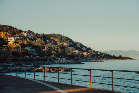 An illustrative photo of a body of water with a hill in the background.