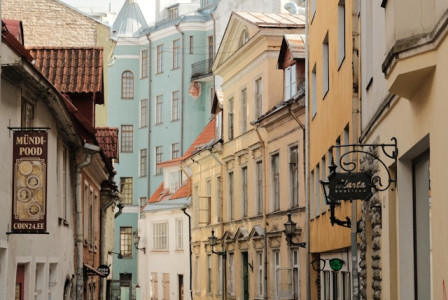 Photo by Unsplash An illustrative photo of a narrow cobblestone street with Estonian buildings