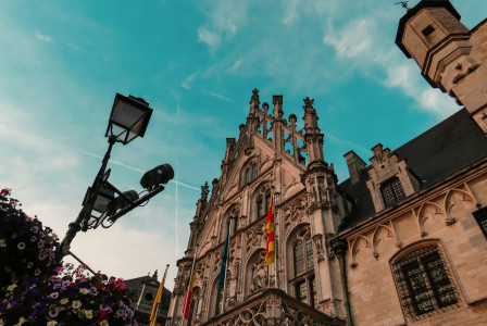Photo by Unsplash An illustrative photo of a beige concrete building in Belgium