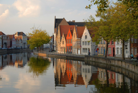 An illustrative photo of houses near channel in Belgium