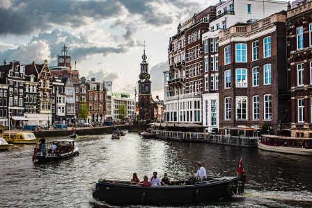An illustrative photo of a canal scene in Amsterdam.