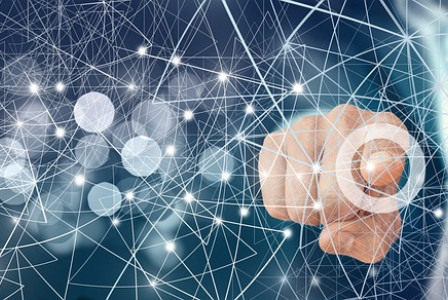 An illustrative photo of a hand interacting with digital elements