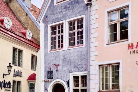 An illustrative photo of a narrow cobblestone street with Estonian buildings